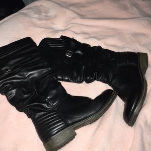 Black knee-high boots with buckles